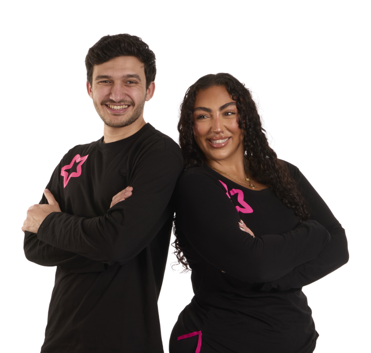 A man and a woman in matching black shirts with pink branding standing back-to-back.